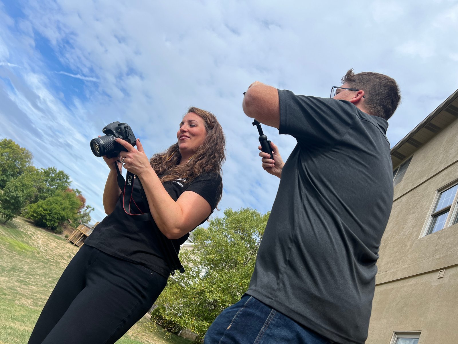 Strong Minded production team setting up a camera and audio outdoors