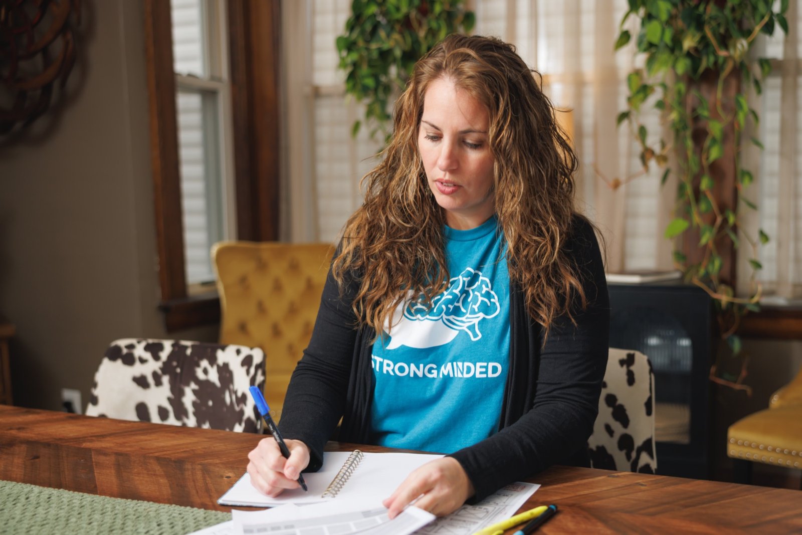 Strong Minded team member making content planning notes