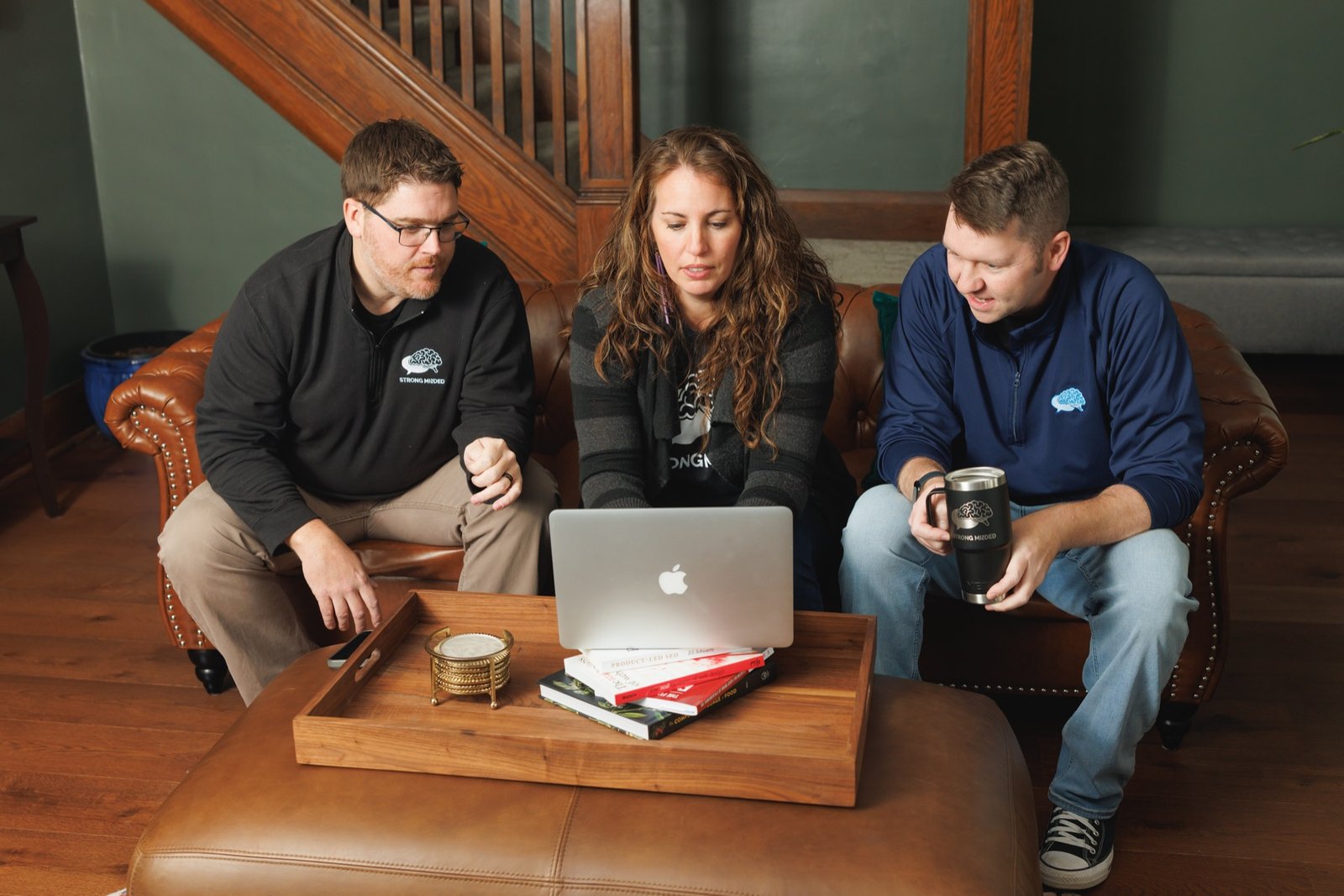 Strong Minded team planning a website together on a laptop